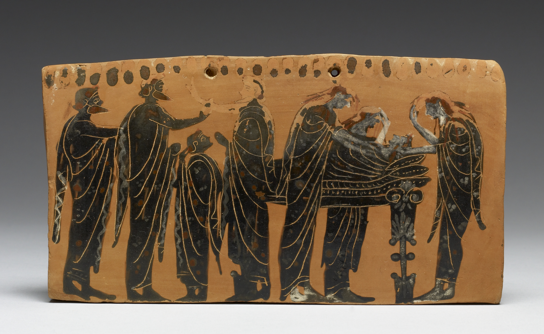  A red-figure painted terracotta tile depicting ancient Greek burial practices.