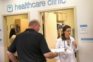 WHEELING, IL - SEPTEMBER 19: Ken Werner gives his health information to nurse practitioner Yana Dymarskiy before getting a flu vaccine at a Walgreens healthcare clinic on September 19, 2013 in Wheeling, Illinois. Walgreens, the nation's largest drugstore chain, yesterday disclosed a plan to provide payments to roughly 160,000 eligible employees for the subsidized purchase of insurance beginning next year. The company says the plan will allow their employees to shop for coverage that best suits their needs through a private health-insurance marketplace. (Photo by Scott Olson/Getty Images)