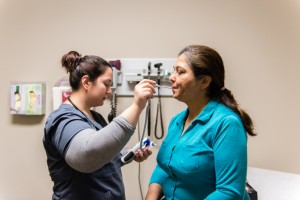 Kavita Ramchandani, 53, gets her temperature taken during her follow-up exam at Porter Ranch Quality Care in Porter Ranch, Calif., on Tuesday, February 16, 2016.  The Bollywood singer says she began wheezing after the gas leak in Porter Ranch and has had to turn down work.  (Heidi de Marco/KHN)