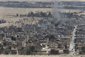 Smoke rises from the modern city of Palmyra, in Homs Governorate, Syria April 1, 2016. REUTERS/Omar Sanadiki