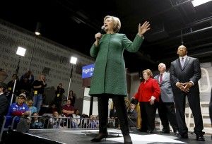 Democratic U.S. presidential candidate Hillary Clinton speaks as members of Congress stand behind her during a campaign rally in Baltimore