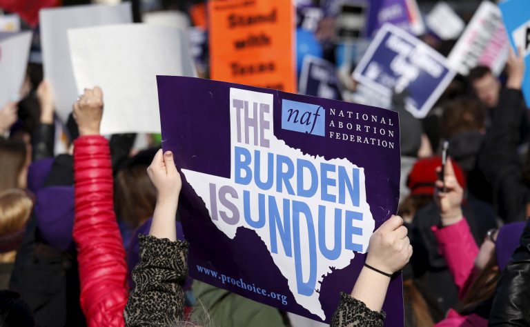 Protesters demonstrate in front of the U.S. Supreme Court in Washington