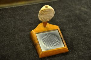 Cylinder Seals in Ancient Mesopotamia: History, Art, and Cultural Significance 5 A flat clay stamp with an image of its impression