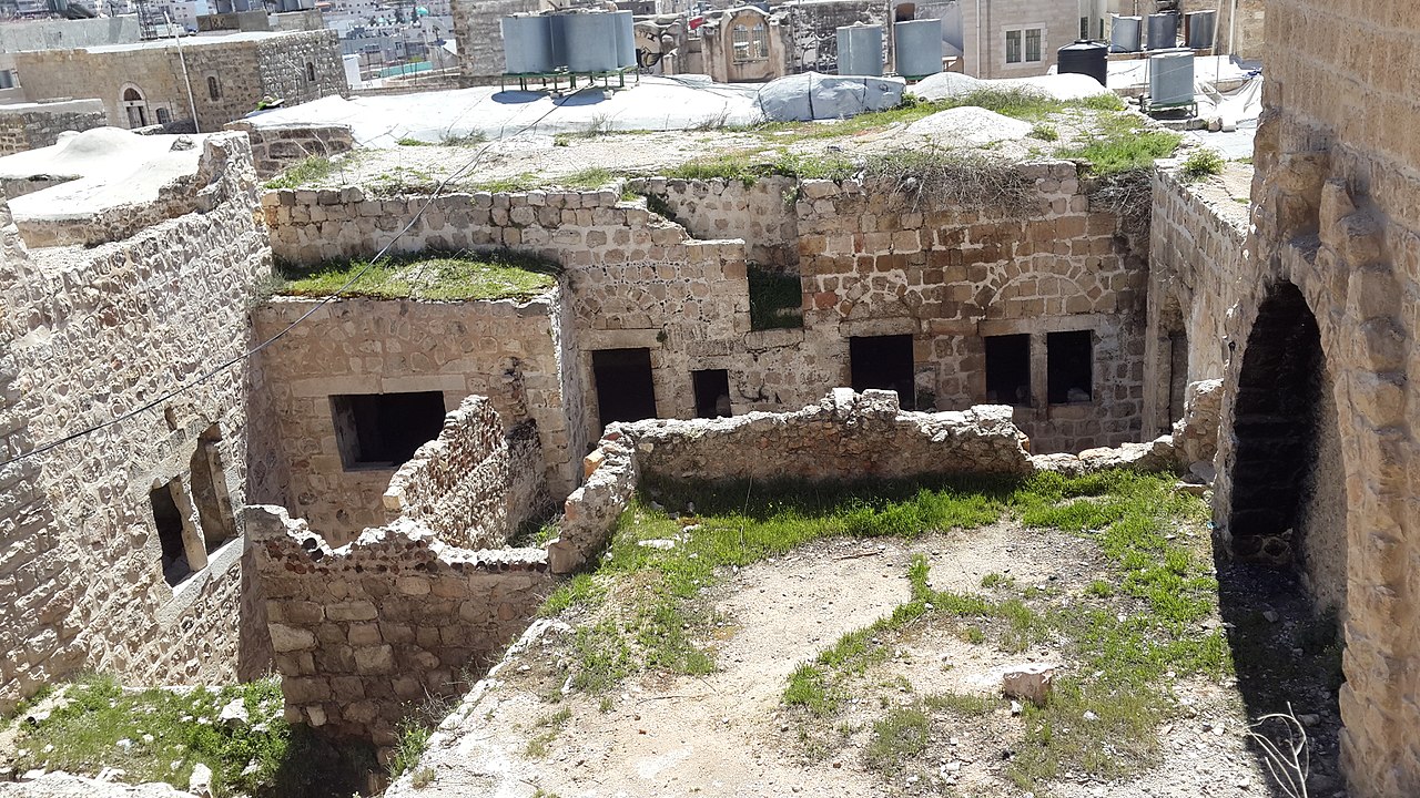  The image shows the ruins of an ancient stone mask of Hebron, representing ancestor veneration.