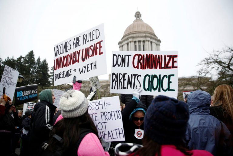 People against mandatory vaccinations participate in the "March for Medical Freedom" outside the Legislative Building to protest SB 5841 in Olympia, Washington