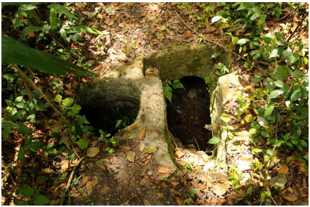 Entrance to Mayan chultan located in Tikal, Guatemala.