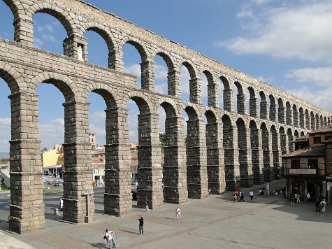 The arches of an elevated section of the Roman provincial Aqueduct of Segovia, in modern Spain.