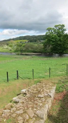 Remains of Hadrian's Wall descending toward the River North Tyne