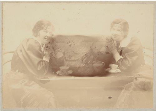 Untitled gelatin silver print made in Wellington of a woman having tea with herself, credited to Joseph Zachariah, ca.1900