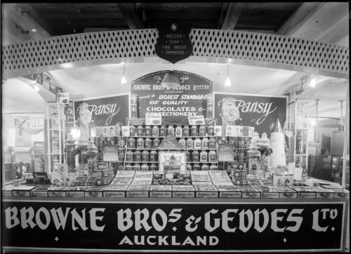 Photograph of a trade fair stall displaying confectionary goods by Browne Brothers & Geddes, Auckland, 1930