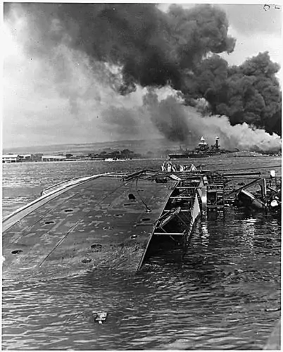 The USS Oglala lies capsized after the Japanese attack on Pearl Harbor