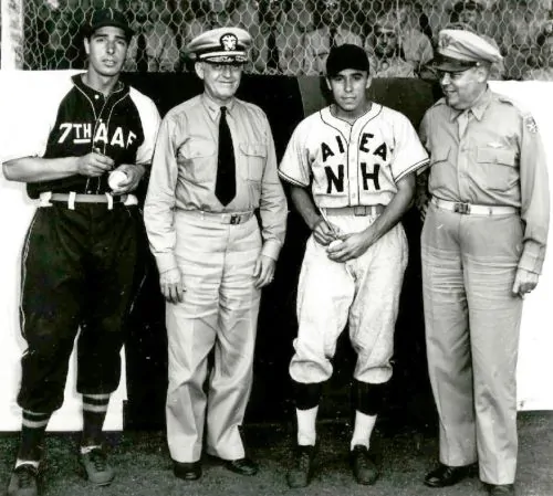 Joe DiMaggio (left) and Pee Wee Reese signing baseballs during their enlistment in Japan, 1944