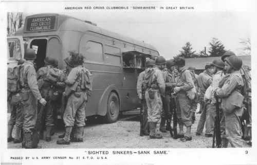 Yanks training for combat on the Continent gather around a Clubmobile in Great Britain