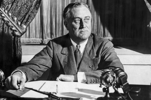 A photo of FDR in the White House on radio.