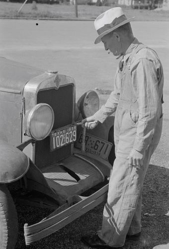 Plate Tectonics: A Brief History of the License Plate and Public Identification 4 Farmer changing license plates, San Augustine, Texas, 1939