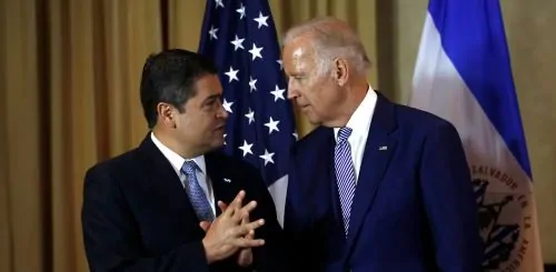 Then-President Juan Orlando Hernandez of Honduras talks with then-Vice President Joe Biden in Guatemala in 2016