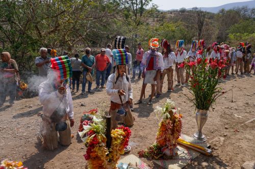 Members of the Nahua community wave smoke over crosses to ask for a bountiful rainy season in Los Corrales