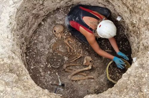Archaeologist excavating a late iron age Durotriges burial at Winterborne Kingston