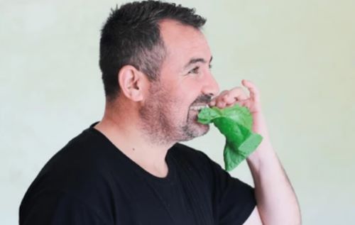 Man eating lettuce