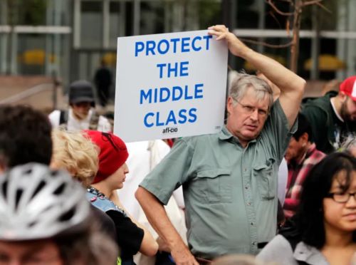 Protestor holding up sign supporting the middle class