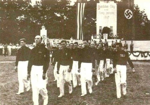 Nazi Landscape in America: The Bund, Camp Siegfried, and Long Island in the 1930s 13 Blackshirts marching at Camp Siegfried, with an American flag banner and a Nazi swastika banner in the background