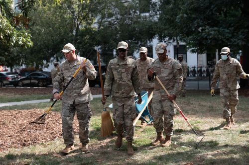 Soldiers with Rakes: Trump’s National Guard Stunt in the Capital 2 Air National Guard airmen work clearing leaves and debris from McPherson Square Park