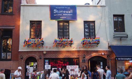 A Quiet Revolution in Identity: The Rising Tide of LGBTQ+ Visibility in America 8 Greenwich Village, a gay neighborhood in Manhattan, is home to the Stonewall Inn, shown here adorned with rainbow pride flags