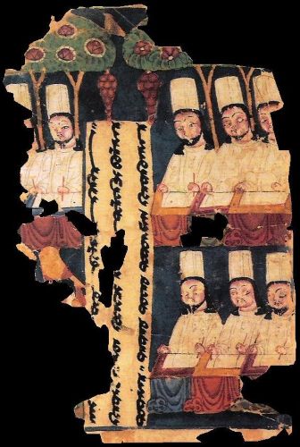 Manichaean priests, writing at their desks. Eighth or ninth century manuscript from Gaochang