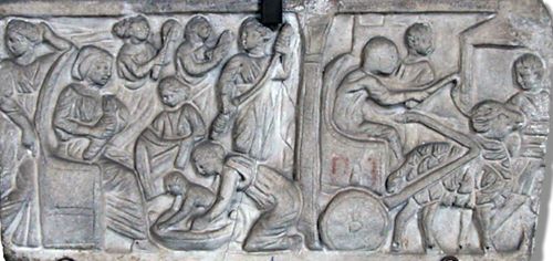 Relief of slaves on the front panel of a marble sarcophagus for a free-born child