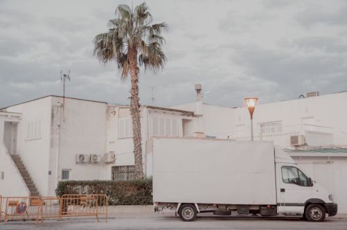 A modern American family moving day with a long-distance truck