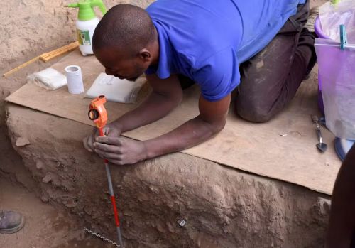 Excavators began finding a thick ash deposit about 2 feet (0.6 meters) under the modern-day surface of the rock shelter