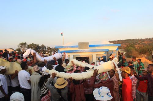 Famadihana is a deeply rooted cultural practice in Malagasy society, where it's believed that the dead continue to influence the lives of the living.