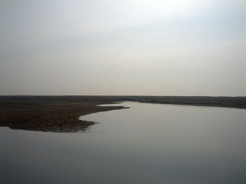 View of the Sidoarjo mud expanse and flooded area after rainfall