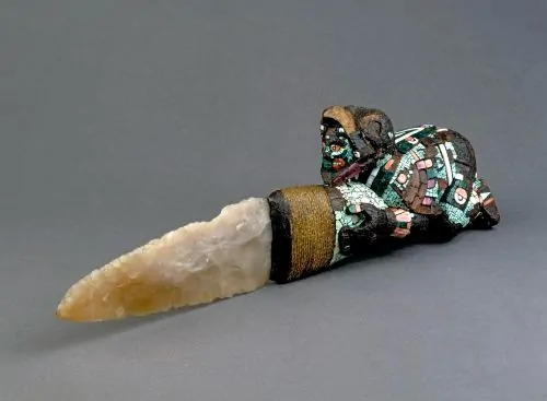 A tecpatl sacrificial knife, in the form of a crouching eagle warrior, with flint blade