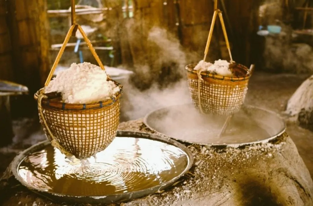 Ancient Sumer and the Salt Disaster That Weakened the First Cities 2 Steam rises from boiling salt in bamboo baskets in an artisanal salt production setting
