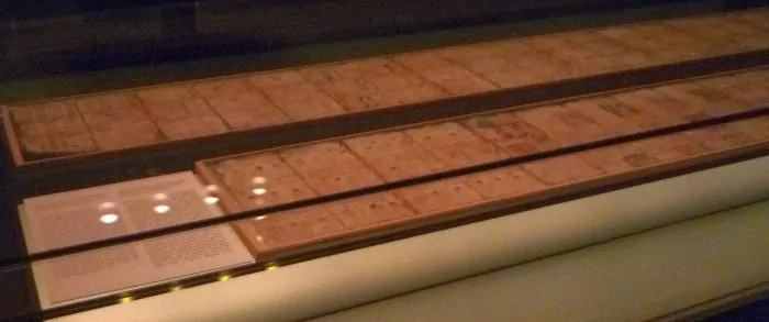 Exhibition of the Dresden Codex, with the backsides visible through mirrors
