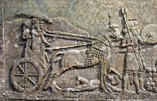 Relief from Dur-Sharrukin depicting Sargon in a chariot, observing an Assyrian attack on a city