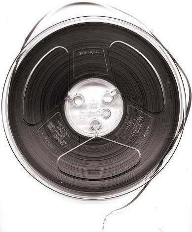 7-inch reel of ¼-inch-wide audio recording tape, typical of consumer use in the 1950s–70s