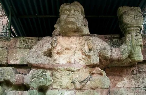 One of two simian sculptures on Temple 11, possibly representing howler monkey gods