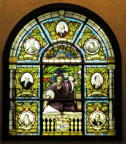 Dickens's portrait (top left), in between Shakespeare and Alfred, Lord Tennyson, on a stained glass window at the Ottawa Public Library, Ottawa, Canada