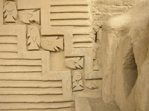 A relief of fish adorns an adobe wall in the historic Tschudi Complex archaeological site at Chan Chan, the former capital of the Chimu Empire in Peru