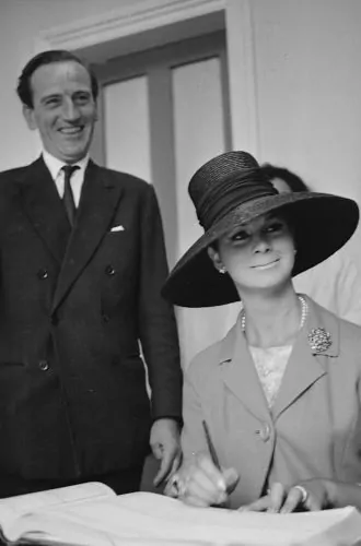 April Ashley signs the marriage register with her husband Arthur Corbett
