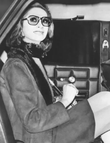 Photo of April Ashley getting out of a car